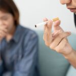 girl having problem with the smell of cigarettes